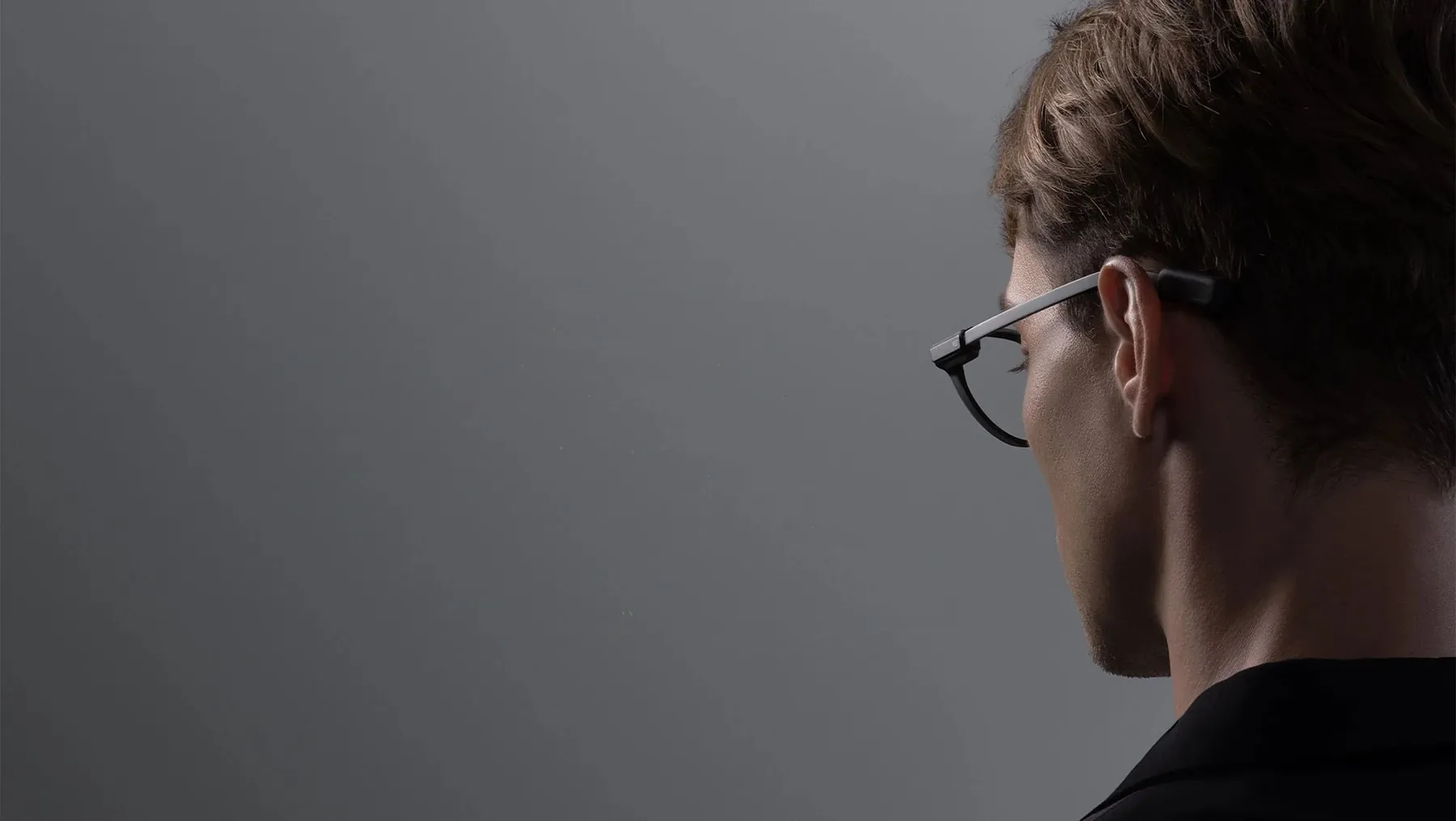A person wearing Even G2 glasses, with Rideshare G2 ride details floating in view